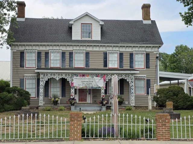 The Preston Historical Museum in a historic house in Preston, Maryland, with a banner advertising a May 2026 garden tour.